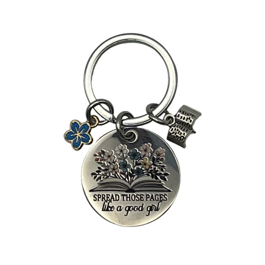 "Spread Those Pages" metal keychain